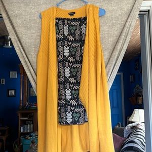 This is a two piece outfit pants are a med by MUDD and sweater dusters